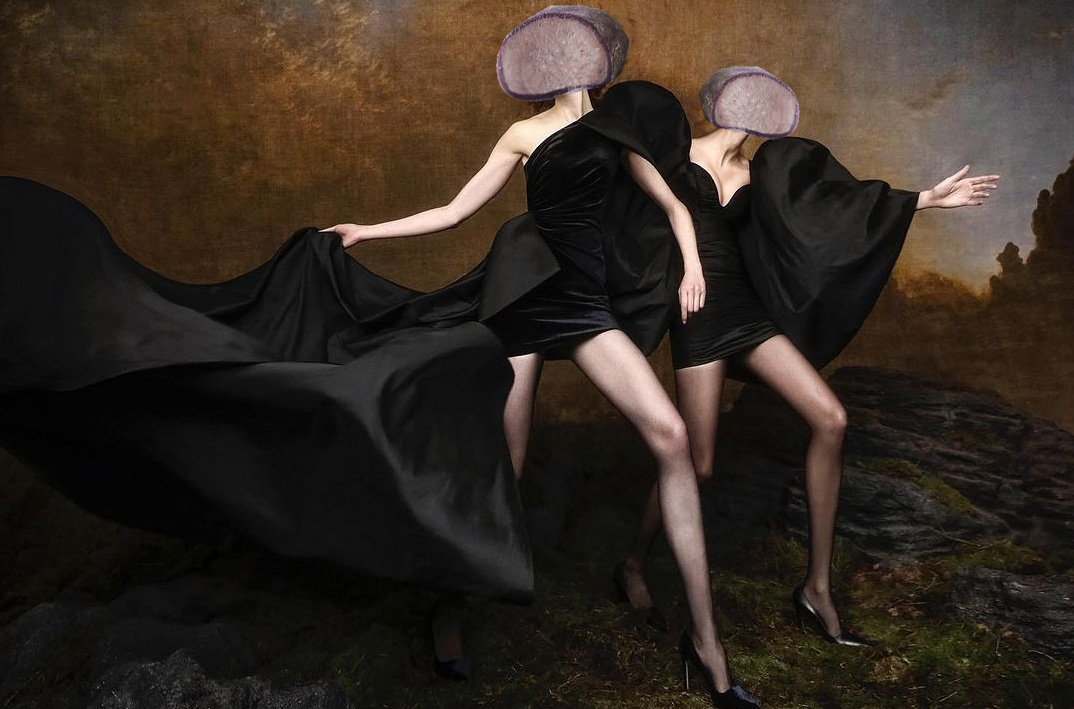 two women in flowing black dresses